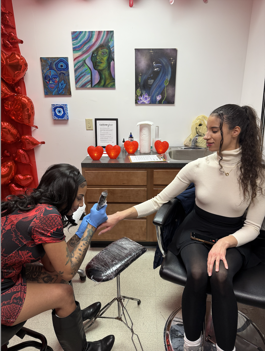 A fine-line tattoo moment at a Good Anatomy experience.